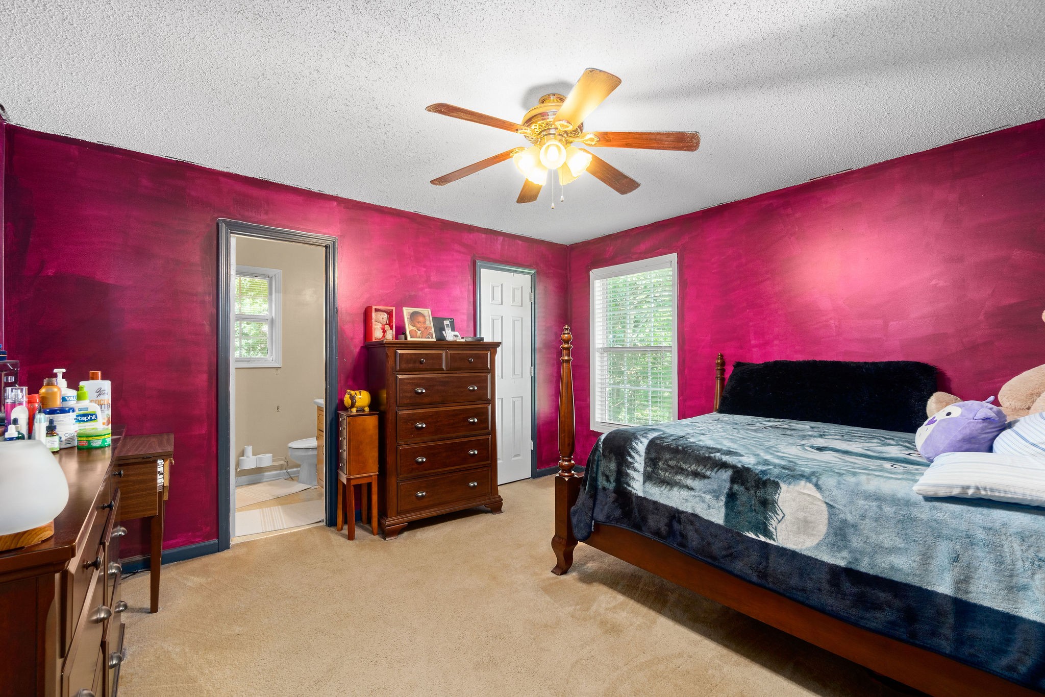 2492 Rafiki Drive Clarksville, TN 37042 - Photo 13 of 24 a bedroom with a bed and a chandelier