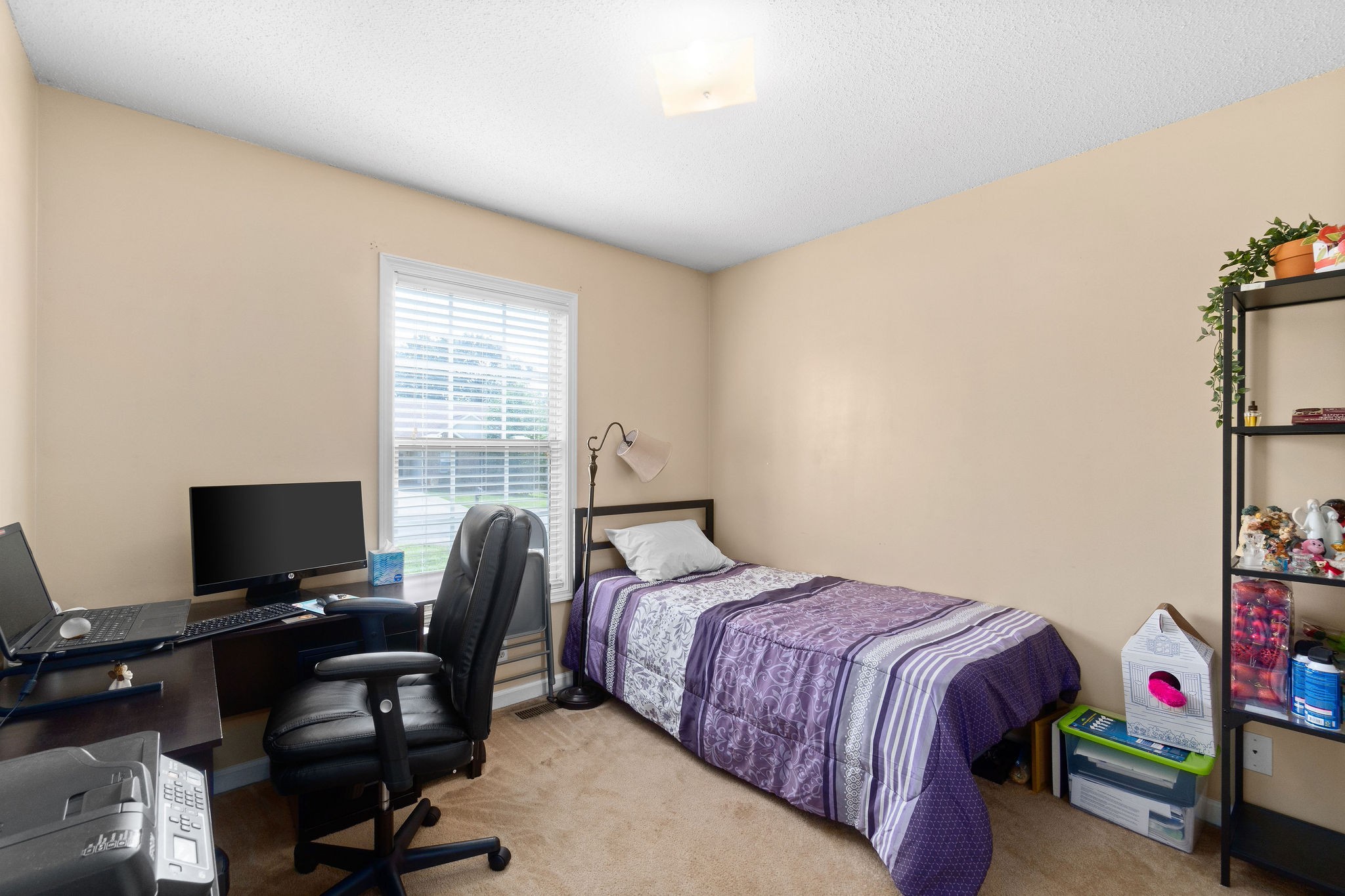 2492 Rafiki Drive Clarksville, TN 37042 - Photo 15 of 24 a bedroom with a bed and a window