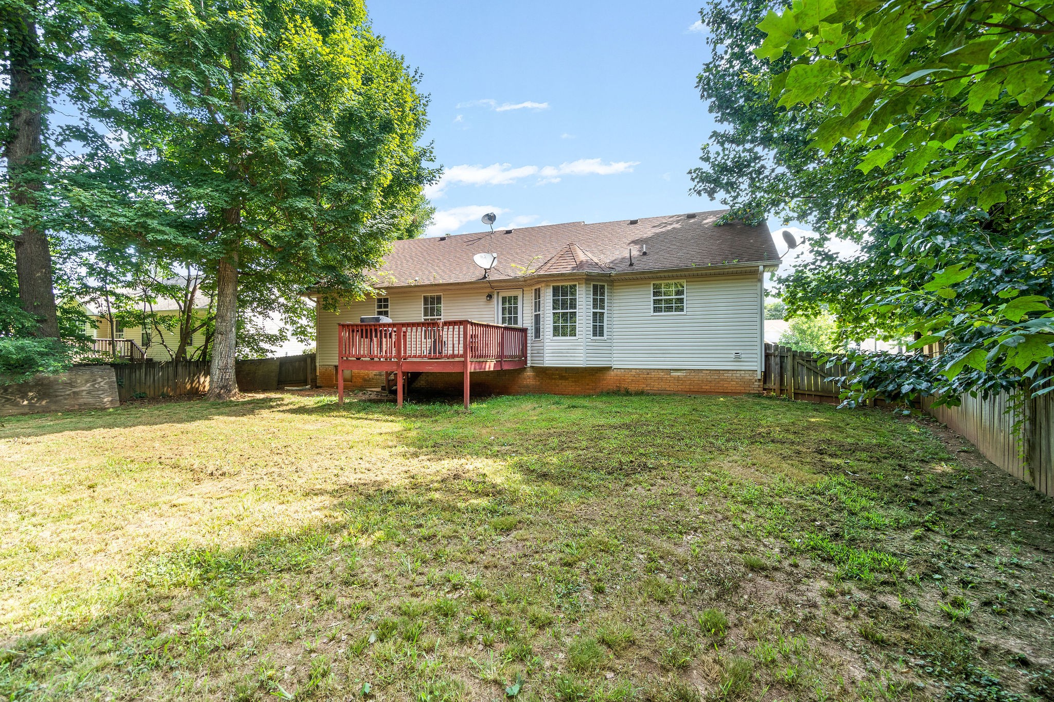 2492 Rafiki Drive Clarksville, TN 37042 - Photo 23 of 24 a backyard of a house with a garden and barbeque oven