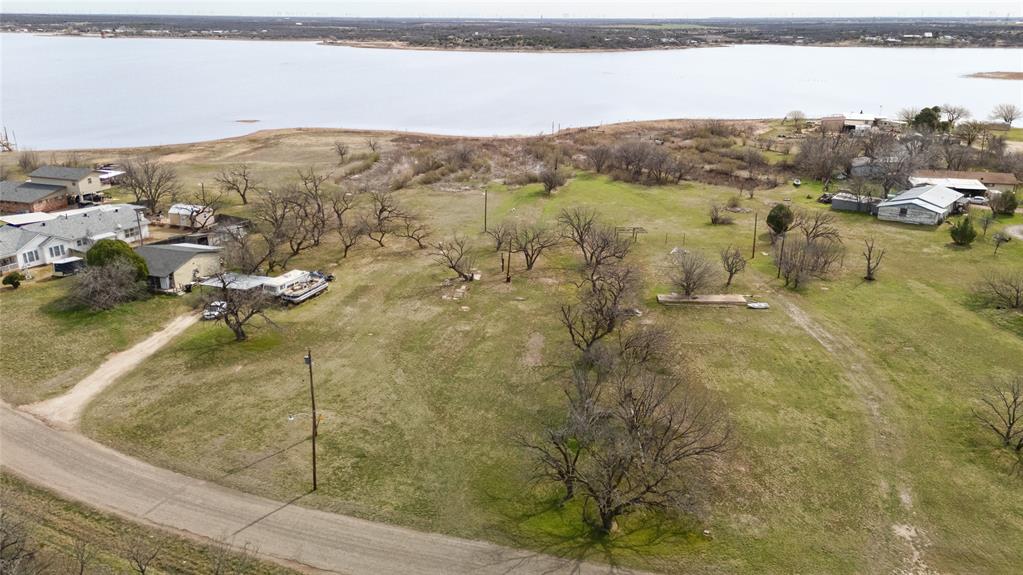 852 Comanche Trail Abilene, TX 79601 - Photo 2 of 3 a view of a lake with mountains in the background