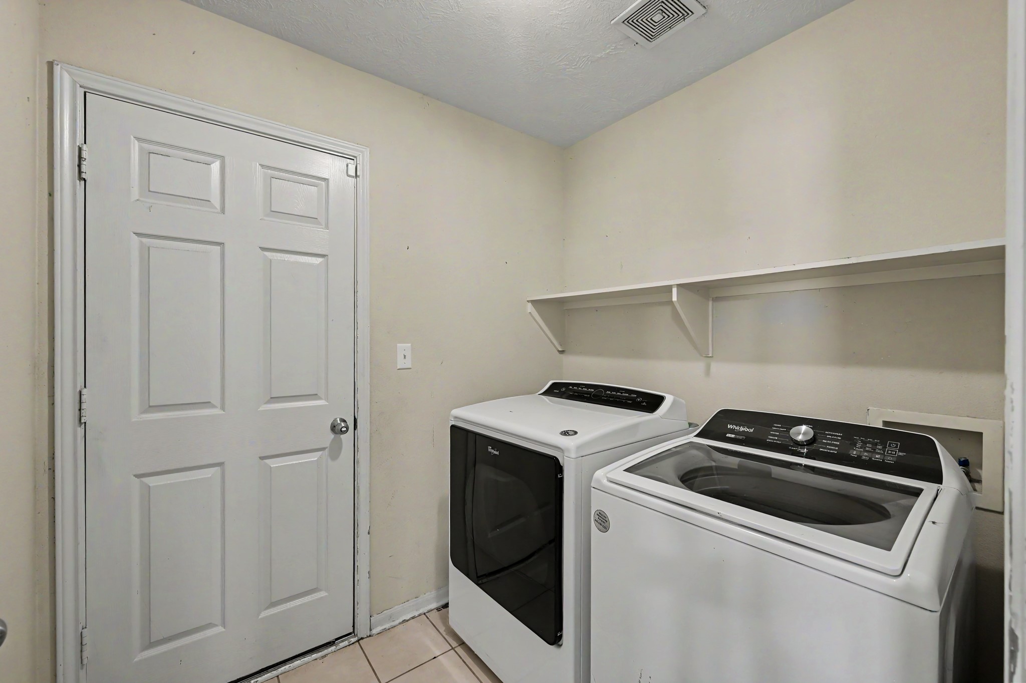 4619 Comal River Loop Spring, TX 77386 - Photo 6 of 16 First stop is your laundry room with the 2 car garage through that door.