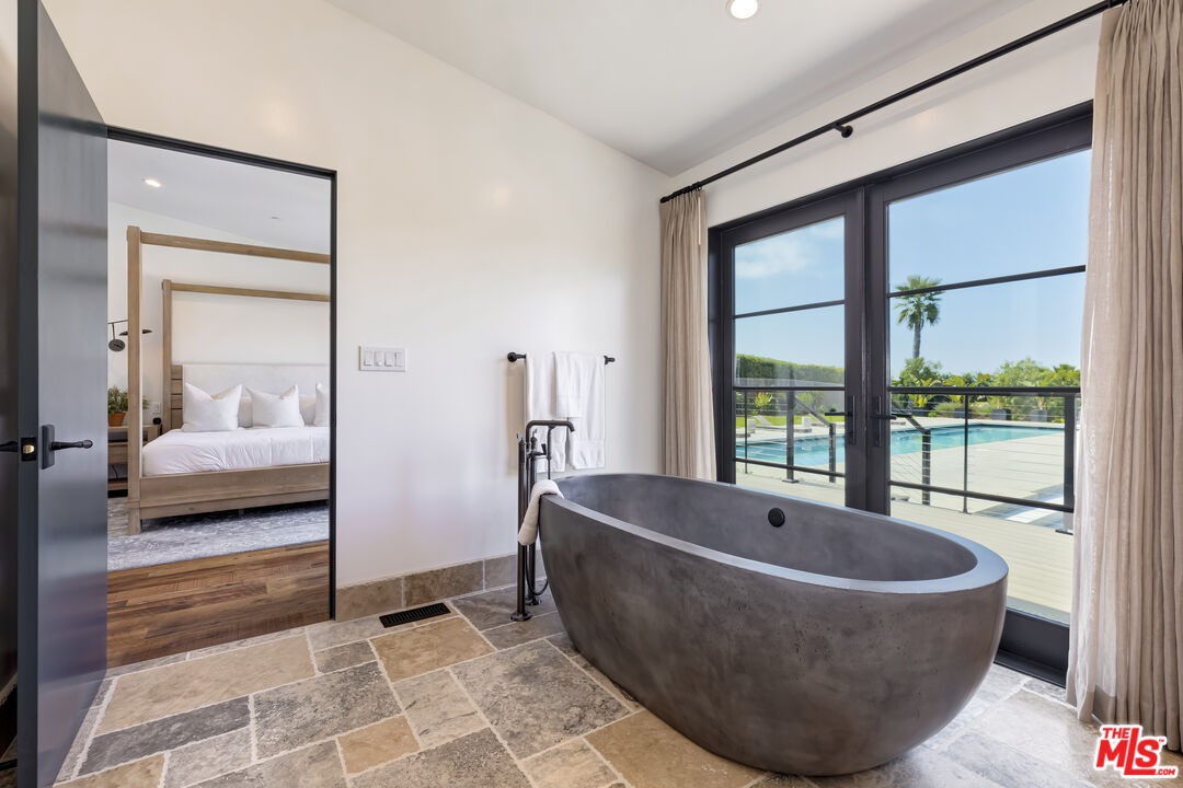 6711 Wandermere Road Malibu, CA 90265 - Photo 17 of 27 a living room with a couch and a large window
