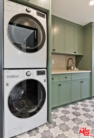 a utility room with a sink and washer