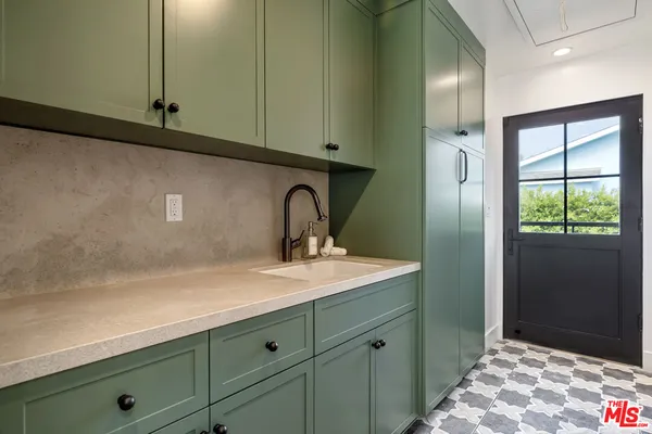 a bathroom with a sink and mirror