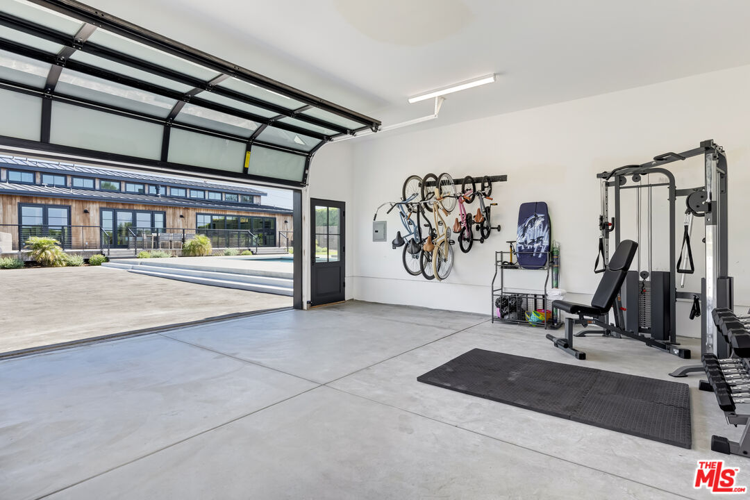 6711 Wandermere Road Malibu, CA 90265 - Photo 24 of 27 a view of a room with gym equipment
