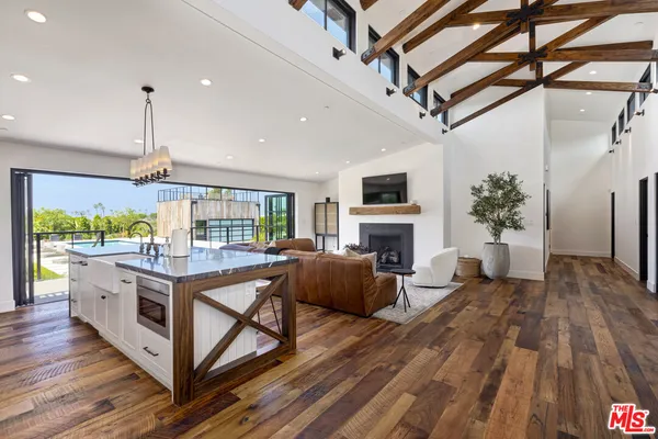 a open kitchen with stainless steel appliances granite countertop a stove and cabinets