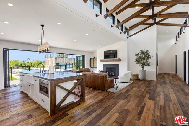 a open kitchen with stainless steel appliances granite countertop a stove and cabinets