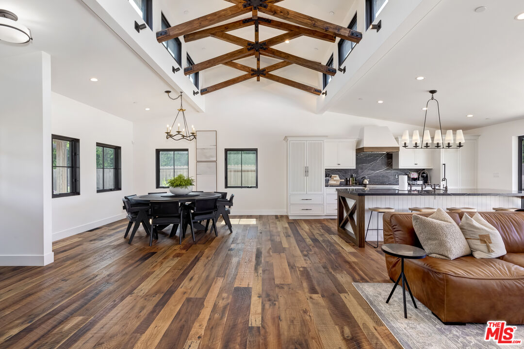 6711 Wandermere Road Malibu, CA 90265 - Photo 5 of 27 a kitchen with stainless steel appliances granite countertop lots of furniture and wooden floors