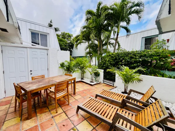 a view of a backyard with a sitting area