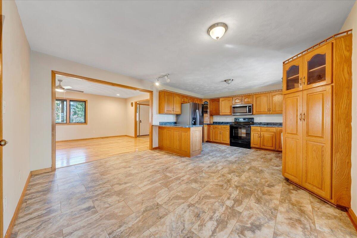 1296 3 Oaks Road Wirtz, VA 24184 - Photo 12 of 59 a view of a kitchen with furniture and wooden floor