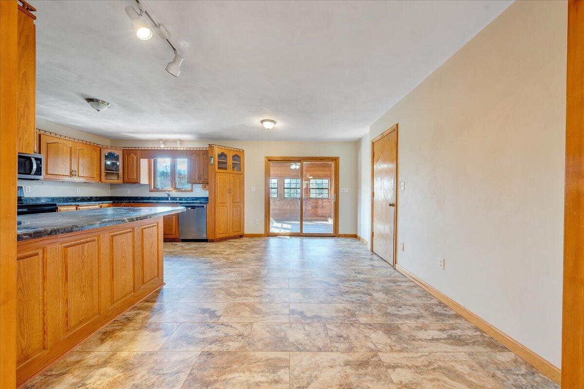 1296 3 Oaks Road Wirtz, VA 24184 - Photo 16 of 59 a large kitchen with stainless steel appliances granite countertop a refrigerator and a stove top oven