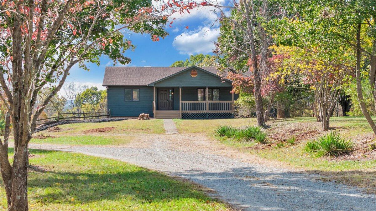 1296 3 Oaks Road Wirtz, VA 24184 - Photo 2 of 59 a front view of a house with a yard