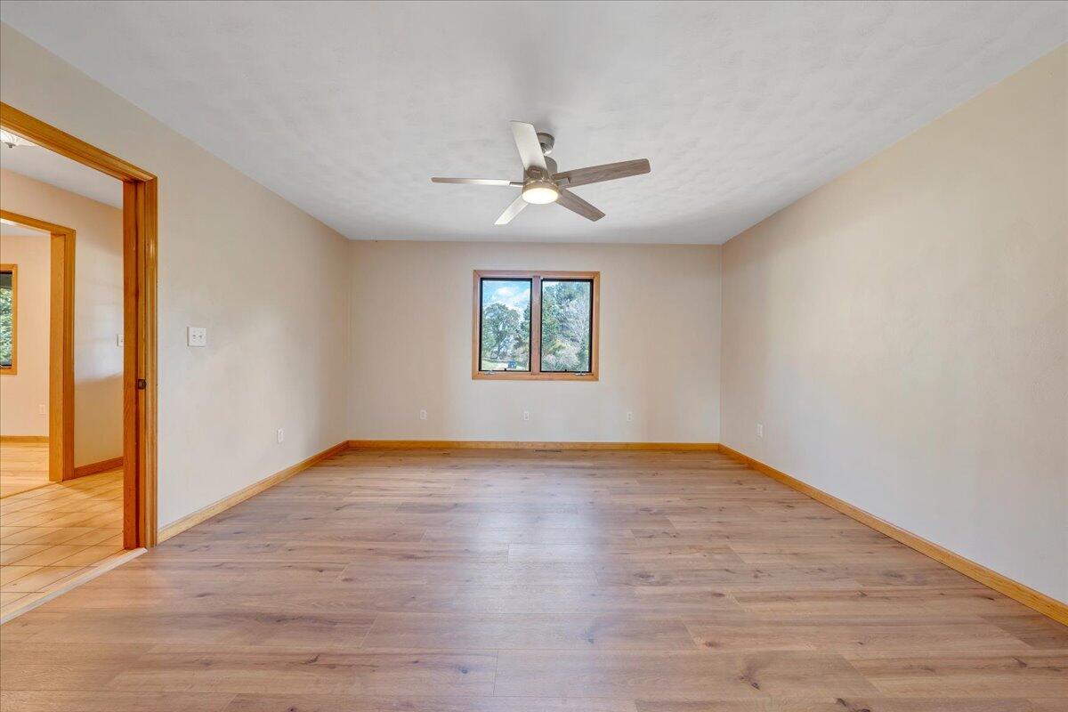 1296 3 Oaks Road Wirtz, VA 24184 - Photo 21 of 59 a view of an empty room with window and wooden floor