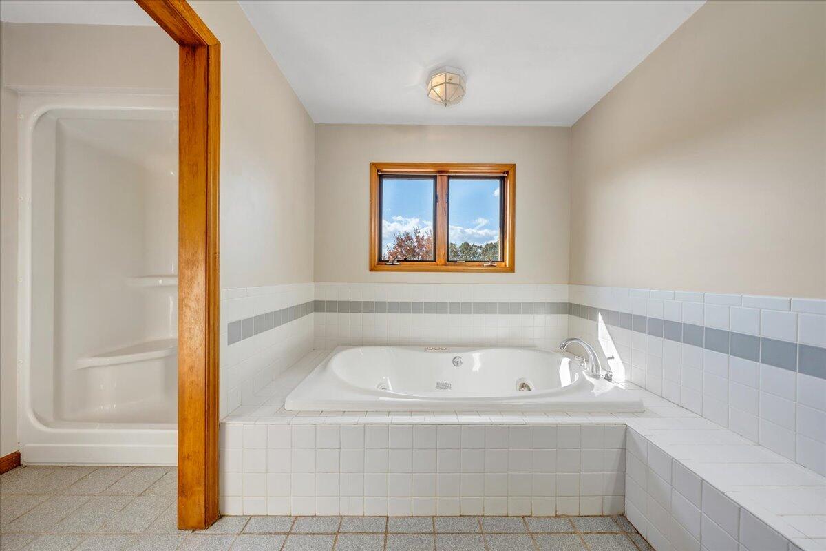 1296 3 Oaks Road Wirtz, VA 24184 - Photo 24 of 59 a white bath tub sitting next to a window