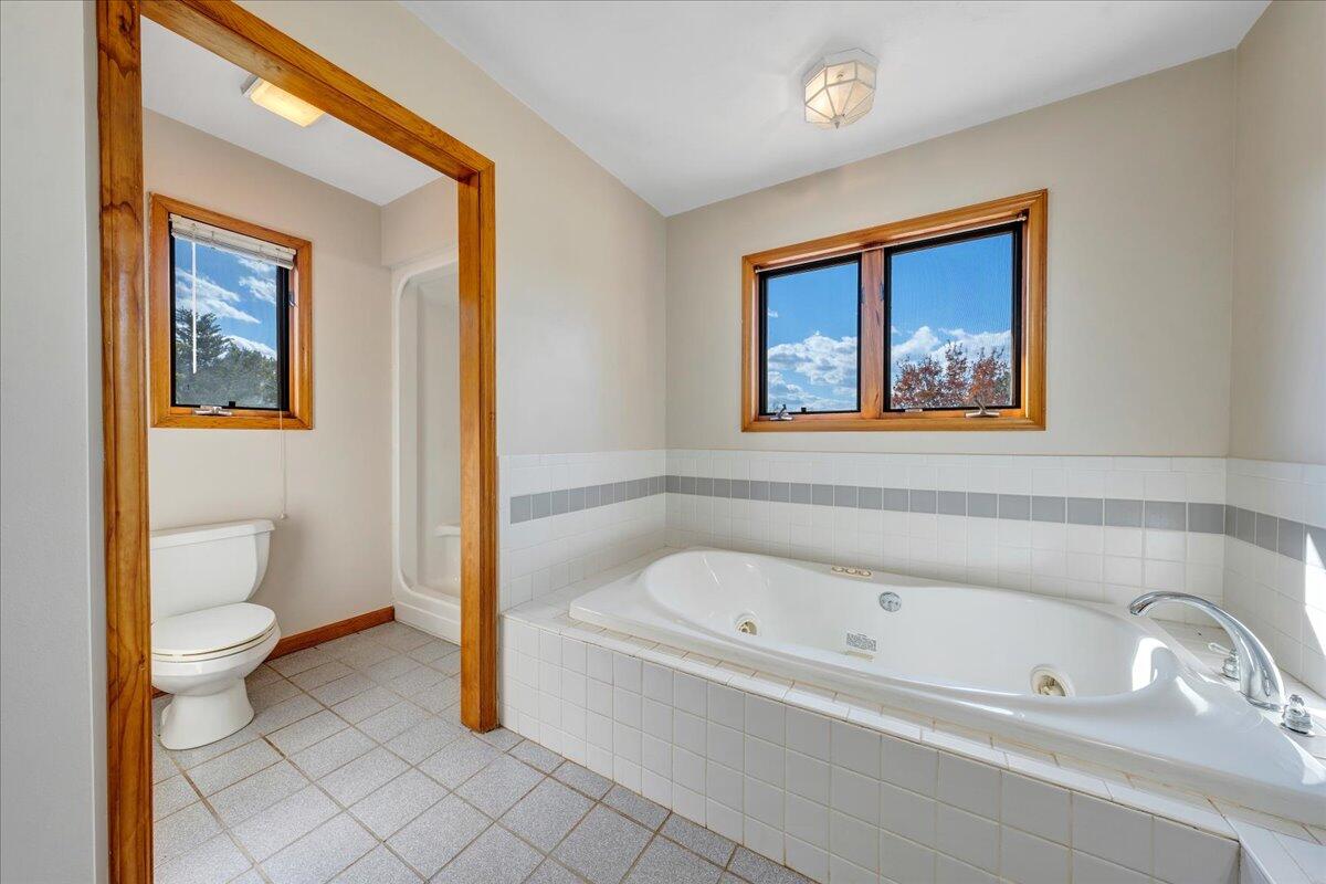 1296 3 Oaks Road Wirtz, VA 24184 - Photo 25 of 59 a bathroom with a bathtub and toilet