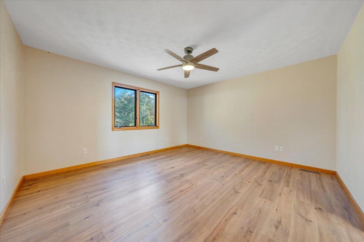 1296 3 Oaks Road Wirtz, VA 24184 - Photo 30 of 59 a view of a big room with wooden floor and windows
