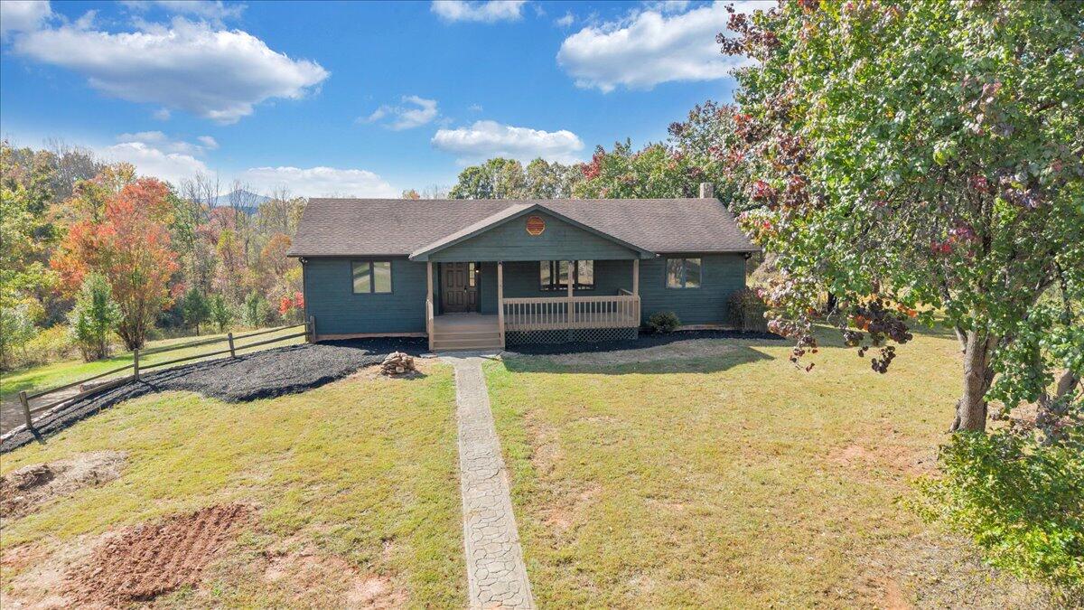 1296 3 Oaks Road Wirtz, VA 24184 - Photo 4 of 59 a front view of a house with a yard