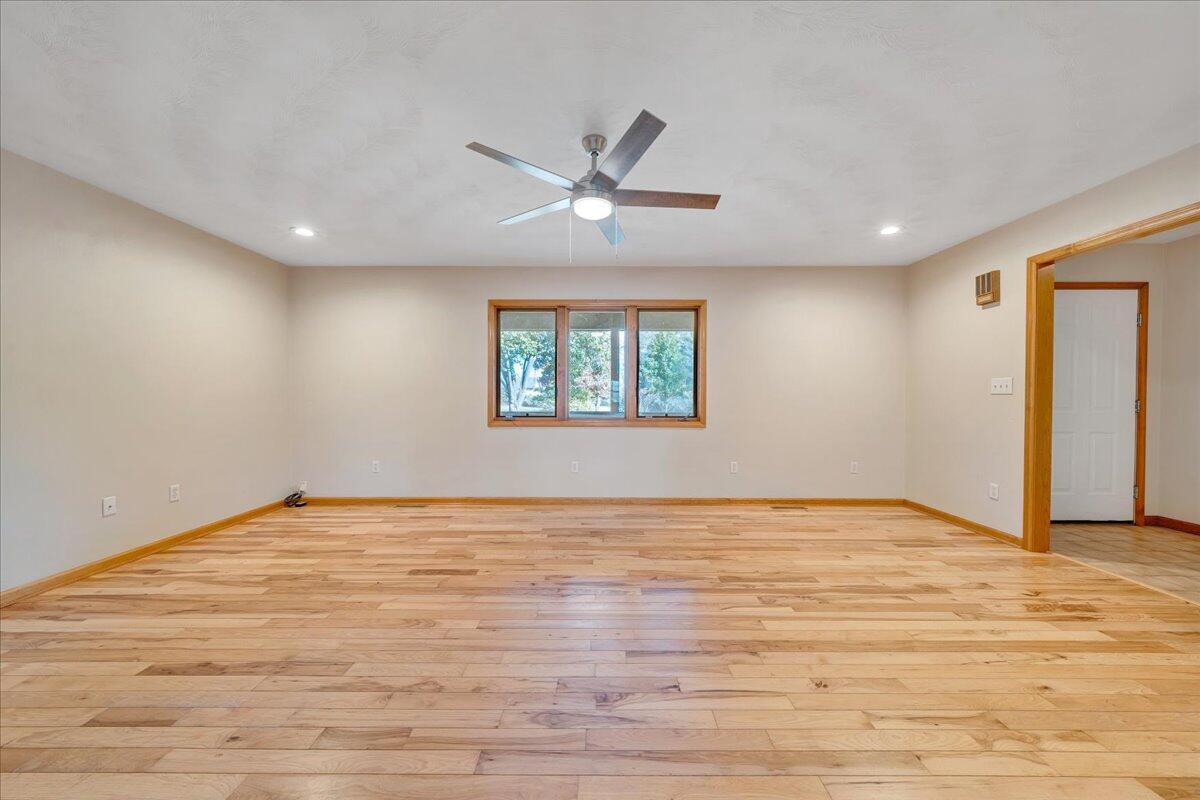 1296 3 Oaks Road Wirtz, VA 24184 - Photo 9 of 59 a view of an empty room with window and wooden floor