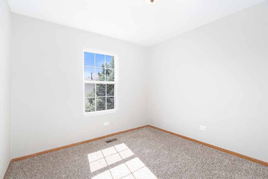 191 Mountain Laurel Court Romeoville, IL 60446 - Photo 14 of 25 an empty room with a window