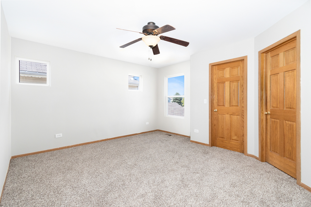 191 Mountain Laurel Court Romeoville, IL 60446 - Photo 16 of 25 a view of an empty room with a window
