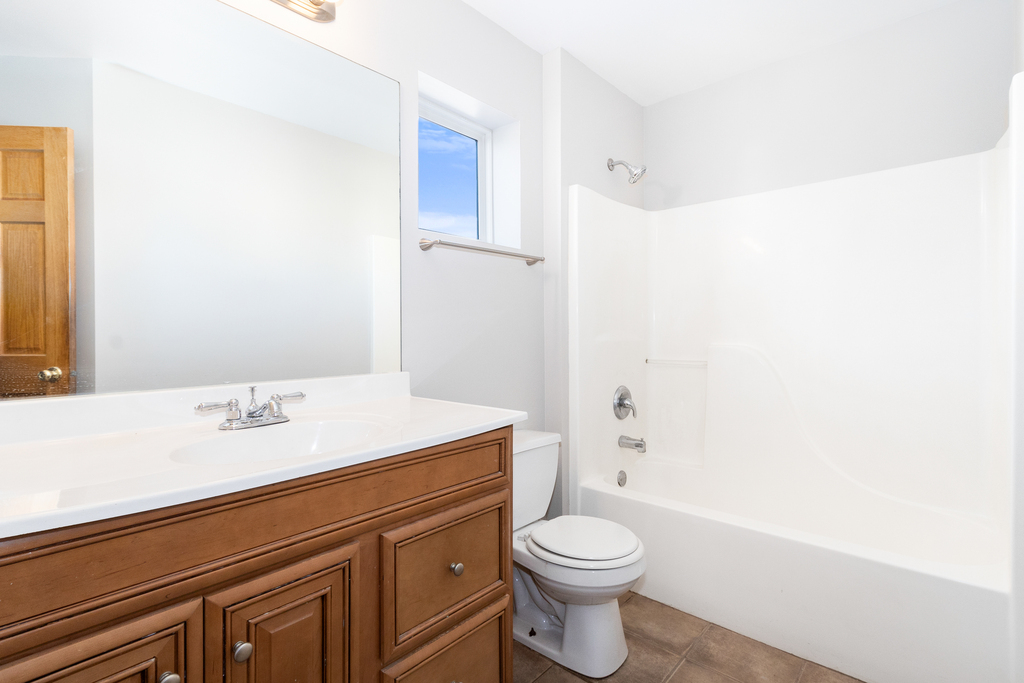 191 Mountain Laurel Court Romeoville, IL 60446 - Photo 17 of 25 a bathroom with a sink a toilet and shower