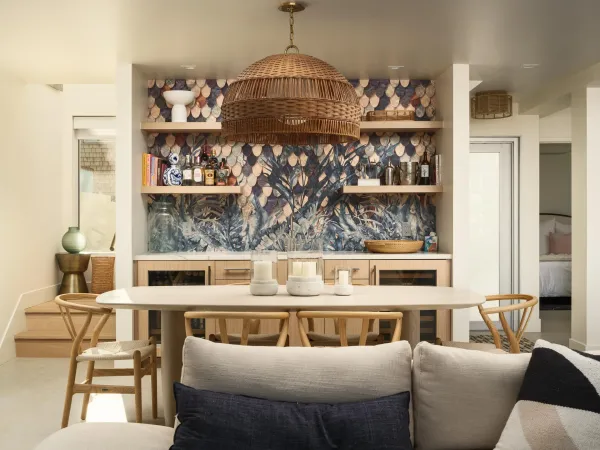 a kitchen with stainless steel appliances kitchen island granite countertop a stove a sink a refrigerator and white cabinets