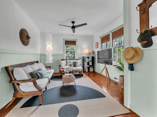 a living room with patio bathtub and a large window