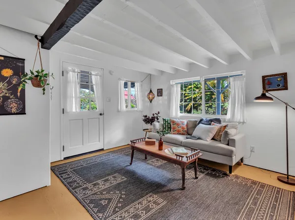 a living room with furniture and a rug