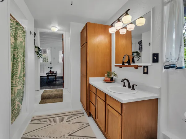a en suite bathroom with sink and mirror