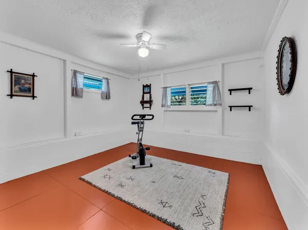 a very nice looking room with a ceiling fan