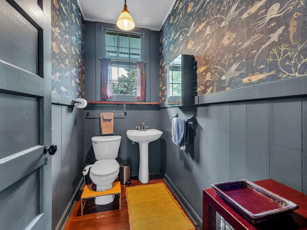 a view of a livingroom with furniture and a window