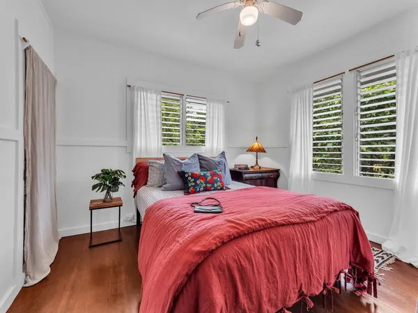 a bed room with a bed and a chandelier