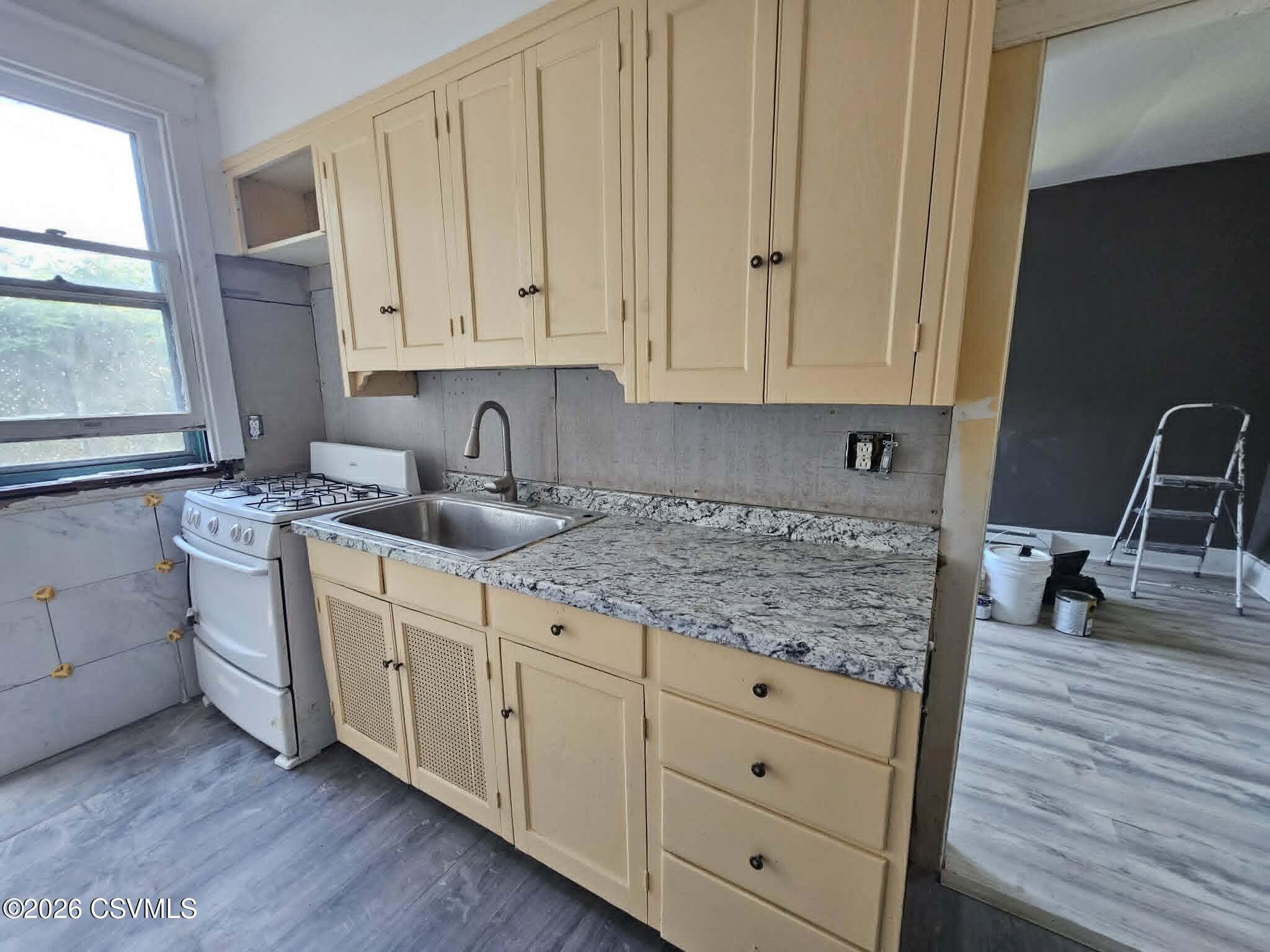 110 Birch Street Shamokin, PA 17872 - Photo 9 of 19 a kitchen with white cabinets sink and dishwasher