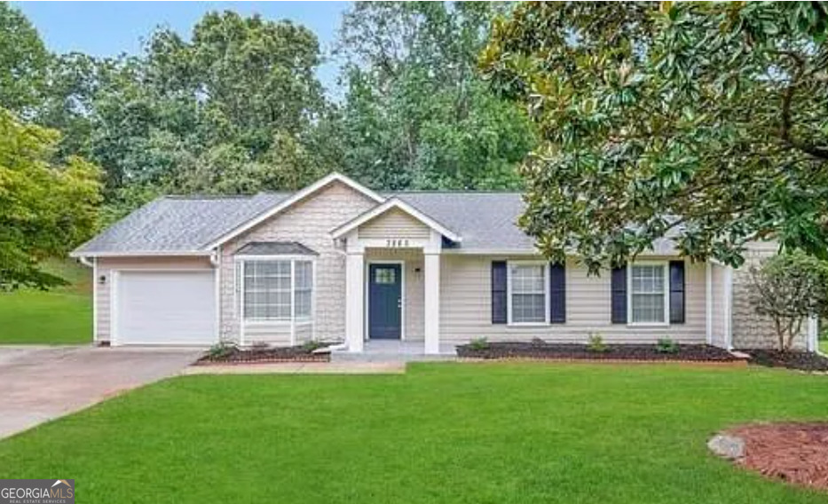 a front view of house with yard and green space
