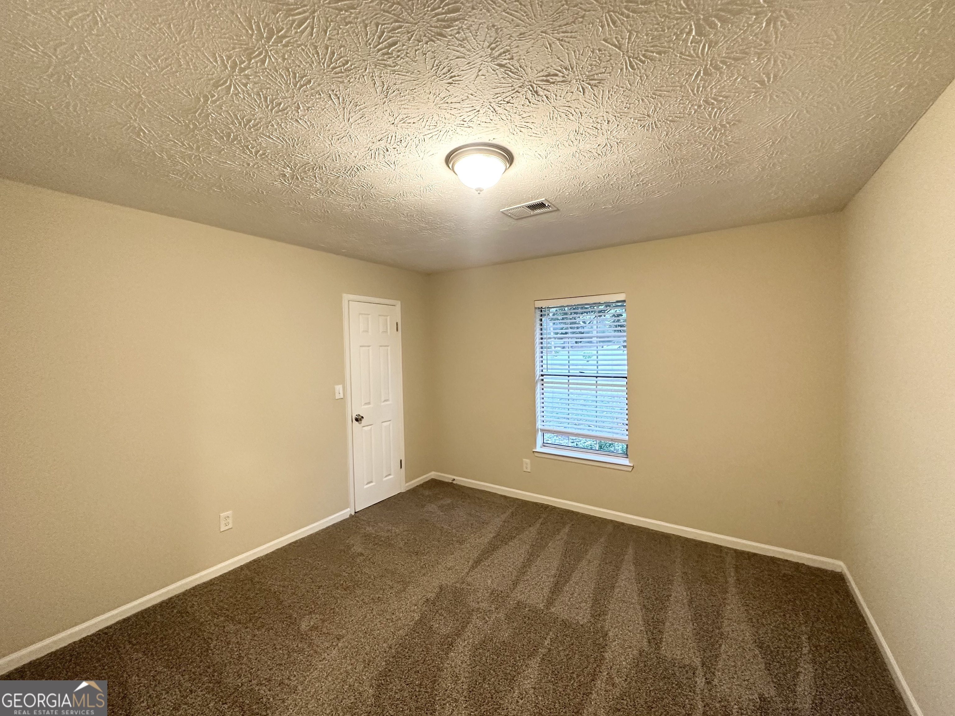 3865 Lehigh Boulevard Decatur, GA 30034 - Photo 13 of 19 an empty room with a empty space and window