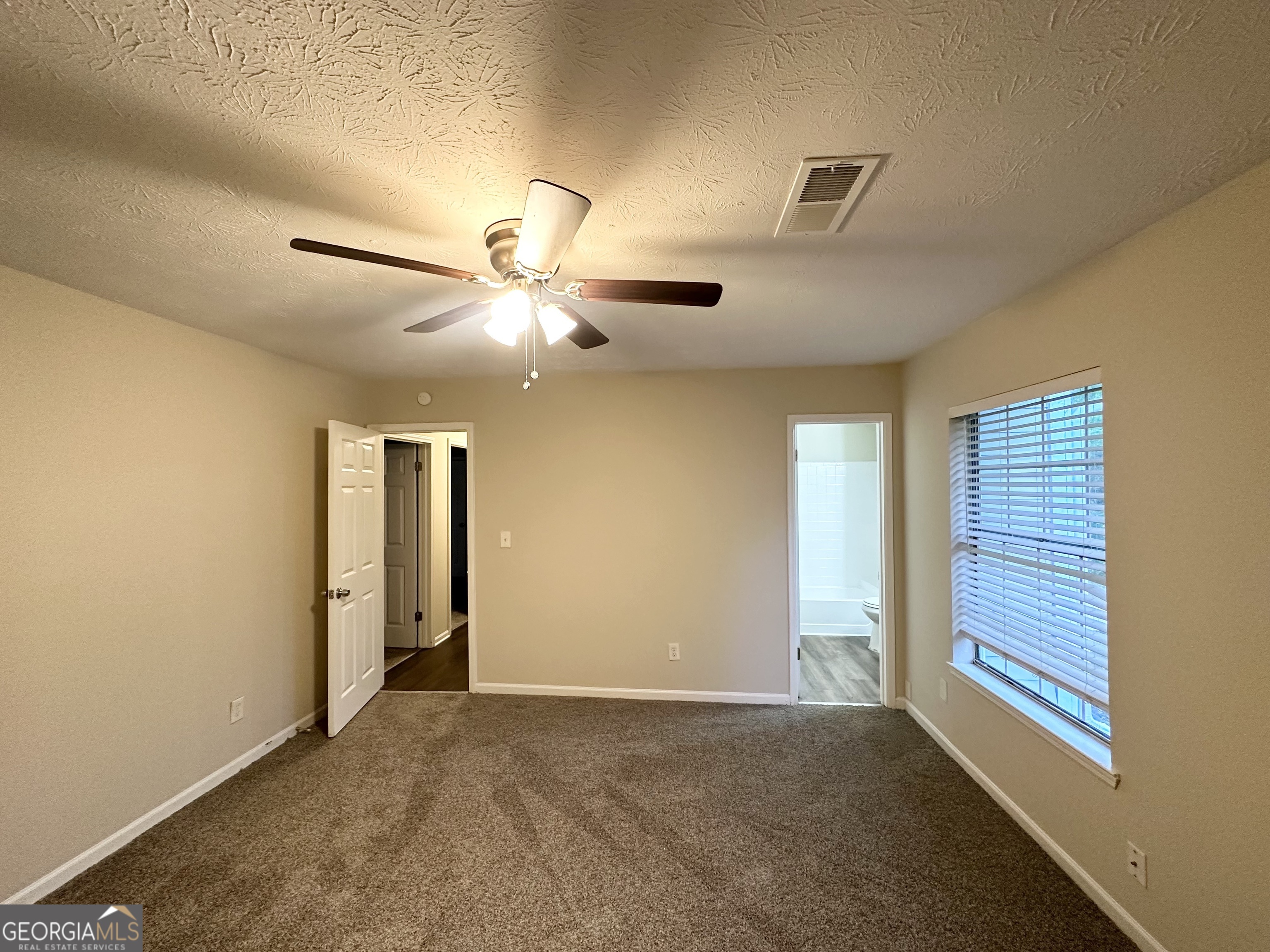 3865 Lehigh Boulevard Decatur, GA 30034 - Photo 16 of 19 a view of a livingroom with a ceiling fan and window