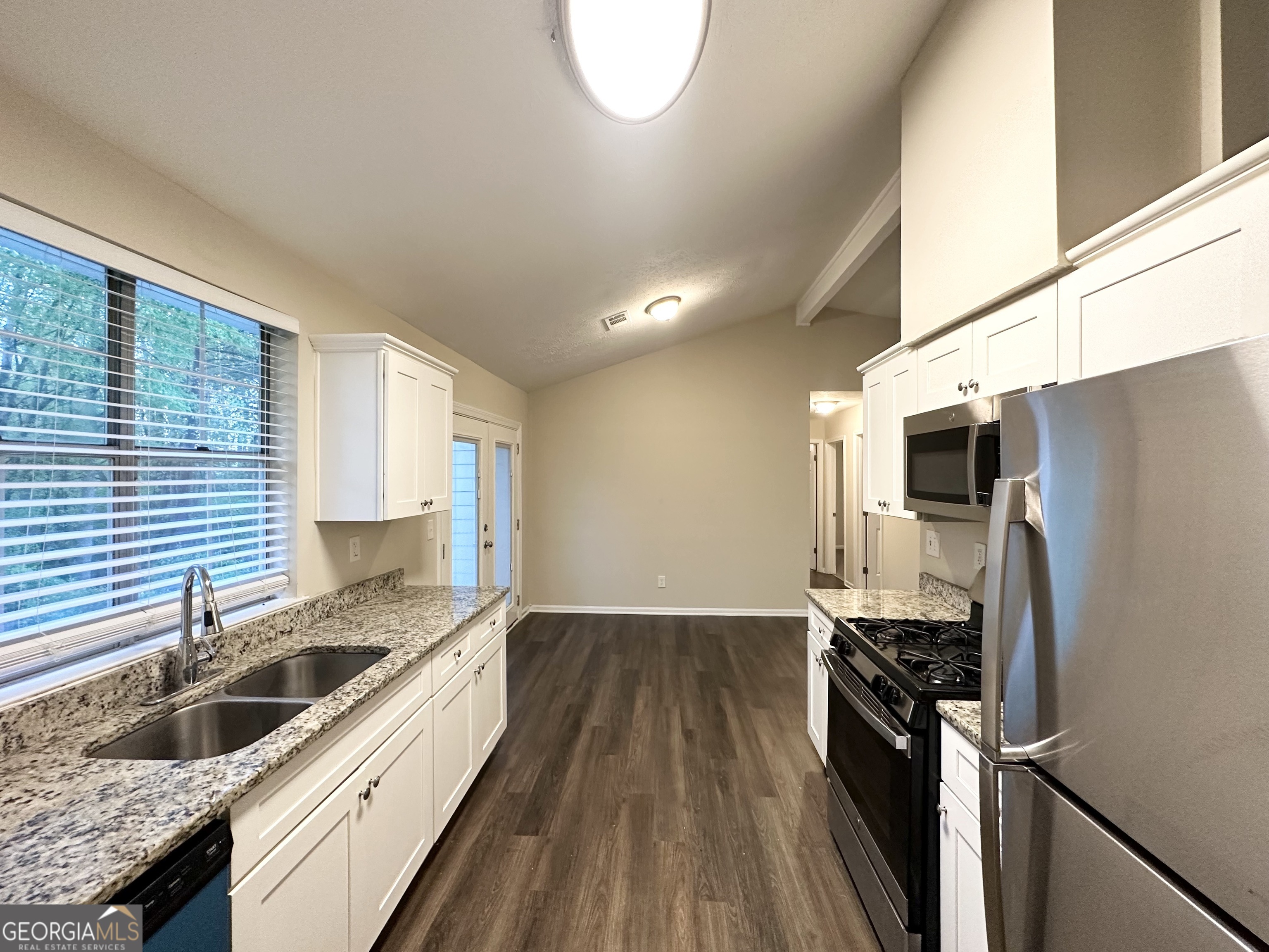 3865 Lehigh Boulevard Decatur, GA 30034 - Photo 8 of 19 a kitchen with a sink stove and refrigerator