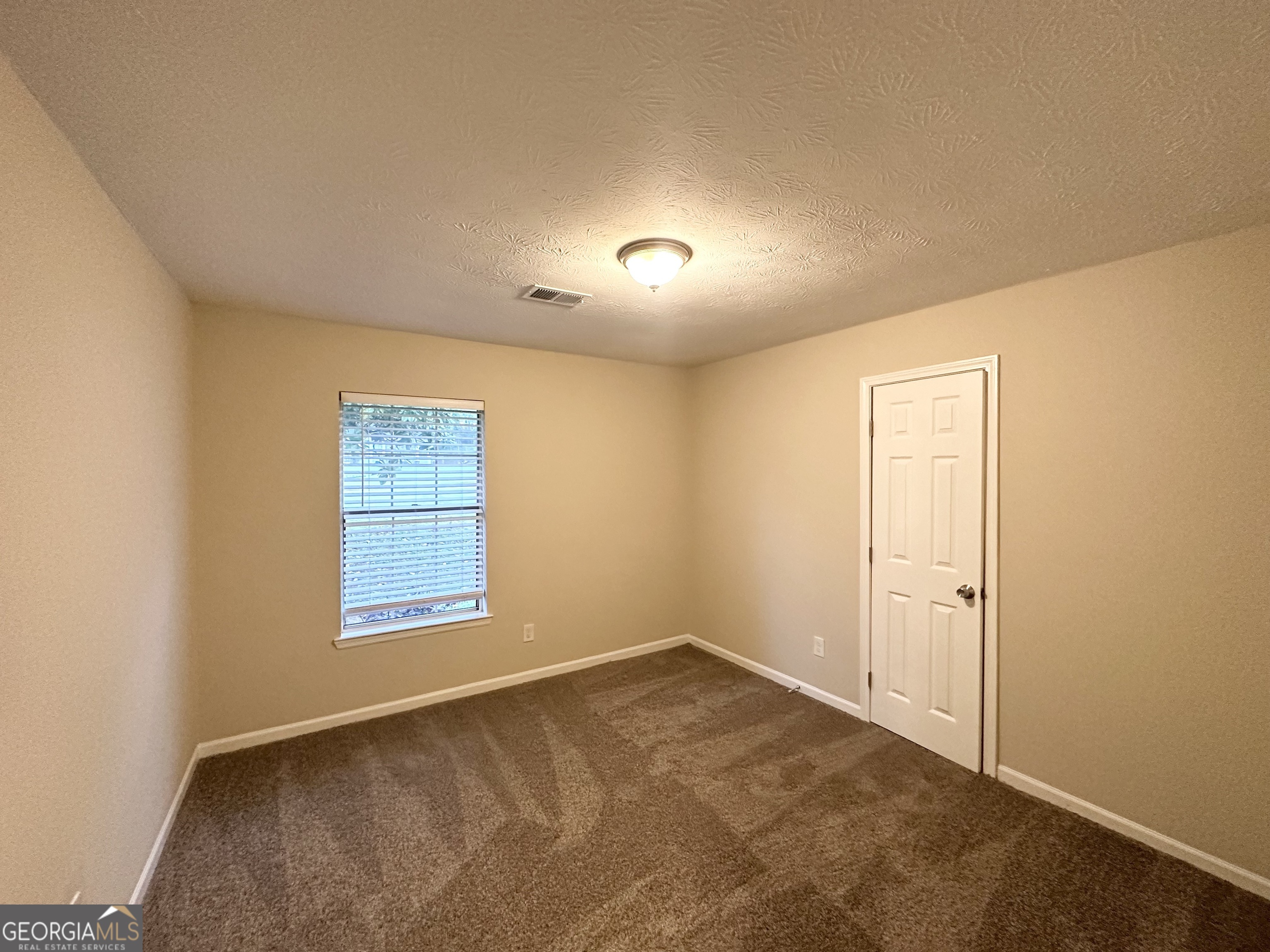 3865 Lehigh Boulevard Decatur, GA 30034 - Photo 9 of 19 an empty room with a window