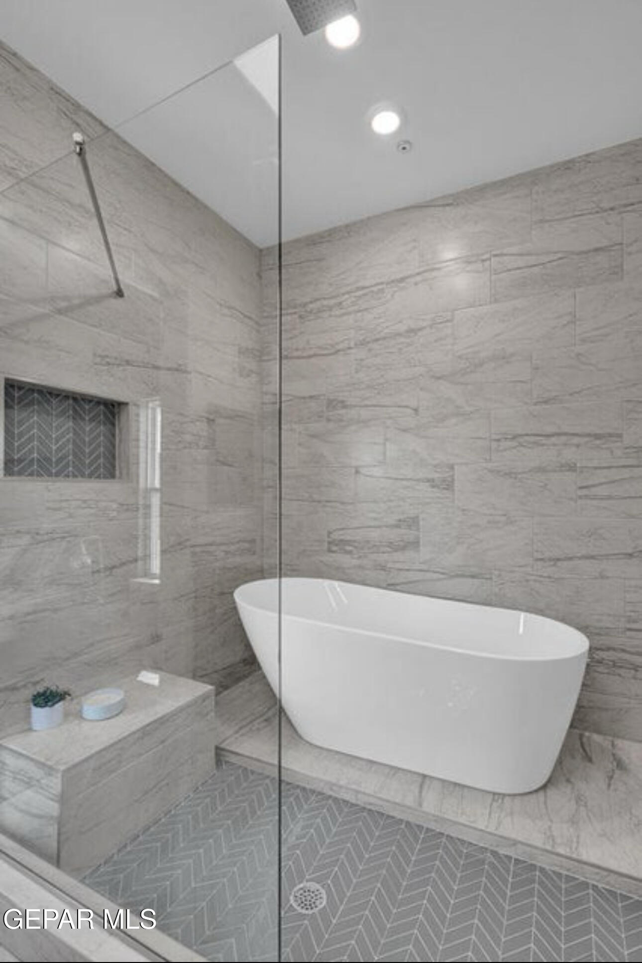 12434 Fill Ball Street El Paso, TX 79928 - Photo 21 of 32 a white bath tub sitting in a bathroom