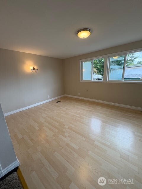 7301 Northeast 175th Street, Unit 137 Kenmore, WA 98028 - Photo 12 of 24 an empty room with a window