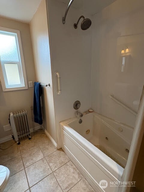 7301 Northeast 175th Street, Unit 137 Kenmore, WA 98028 - Photo 15 of 24 a bathroom with a bathtub and a shower
