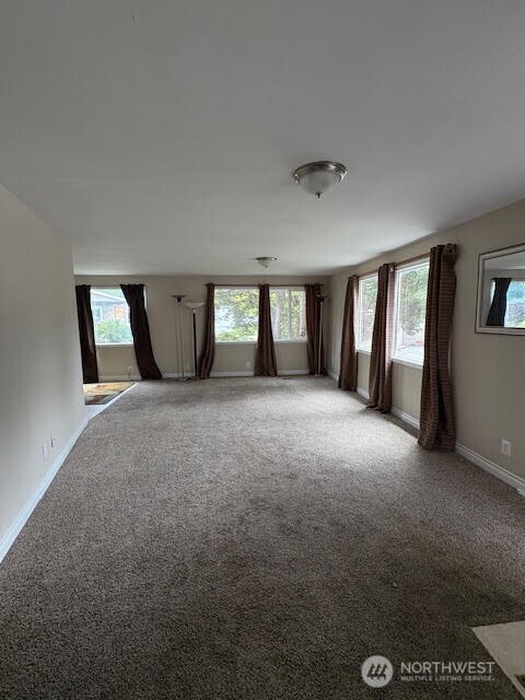 7301 Northeast 175th Street, Unit 137 Kenmore, WA 98028 - Photo 16 of 24 a view of an empty room with windows and closet