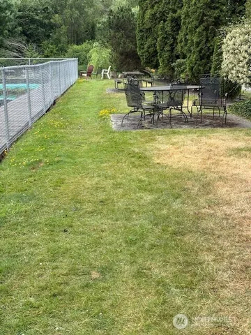 a view of a swimming pool with a patio