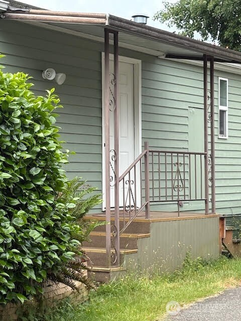 7301 Northeast 175th Street, Unit 137 Kenmore, WA 98028 - Photo 3 of 24 a view of house with a yard