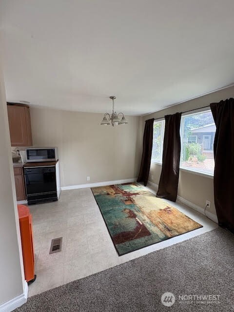7301 Northeast 175th Street, Unit 137 Kenmore, WA 98028 - Photo 10 of 24 a view of kitchen with sink microwave and refrigerator