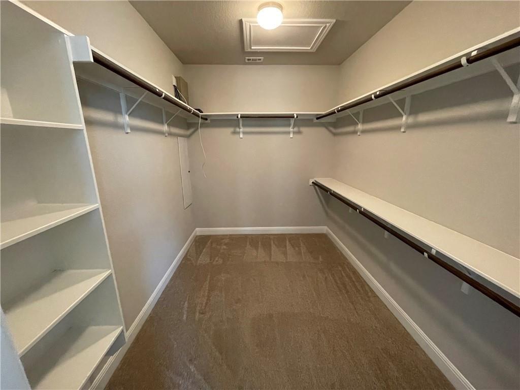 3501 Venezia View Leander, TX 78641 - Photo 11 of 20 a view of a room with racks on the wall