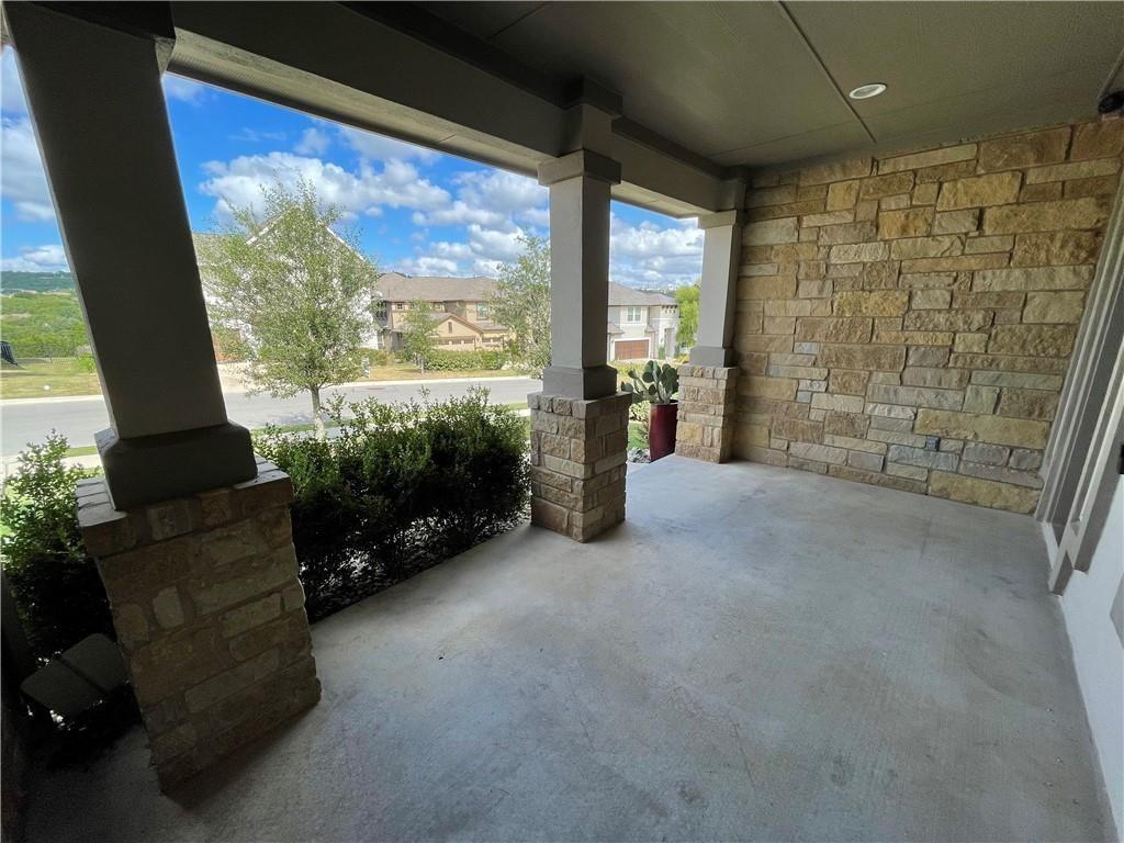 3501 Venezia View Leander, TX 78641 - Photo 15 of 20 a living room with furniture floor to ceiling window and a flat screen tv