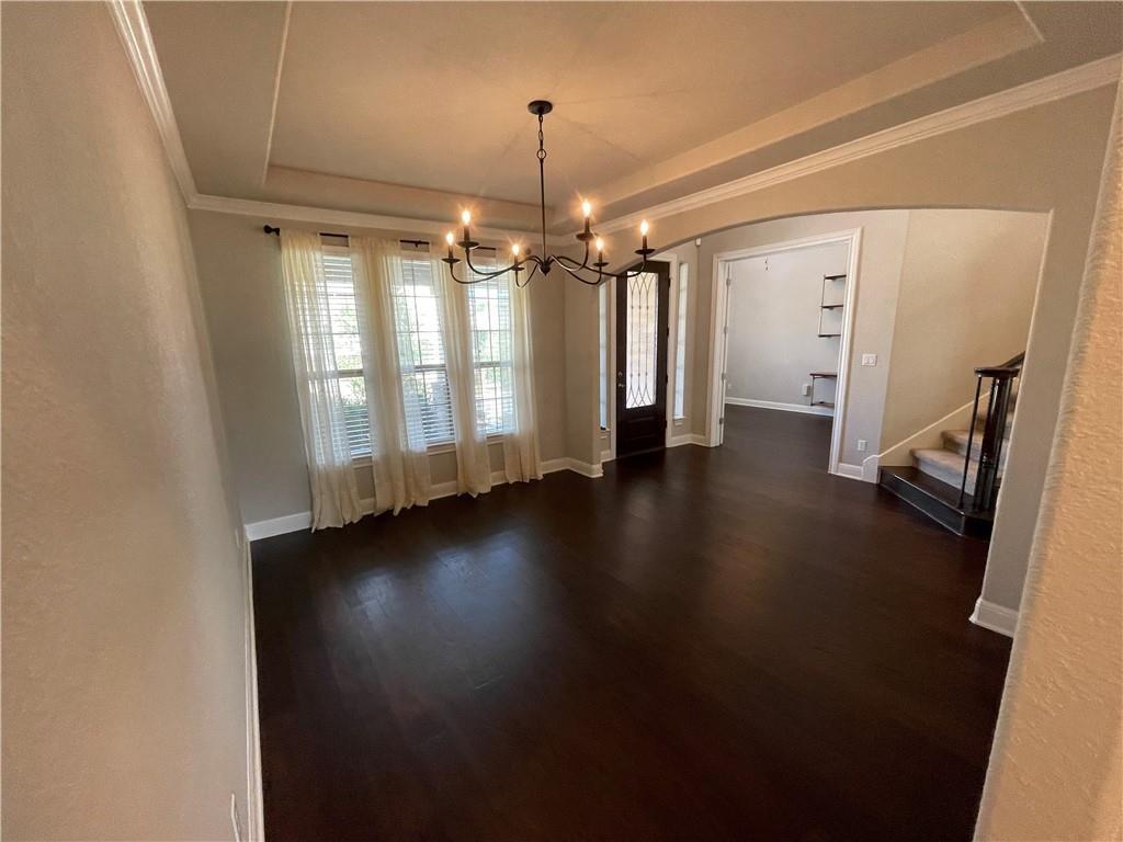 3501 Venezia View Leander, TX 78641 - Photo 5 of 20 a view of an empty room with wooden floor and a window