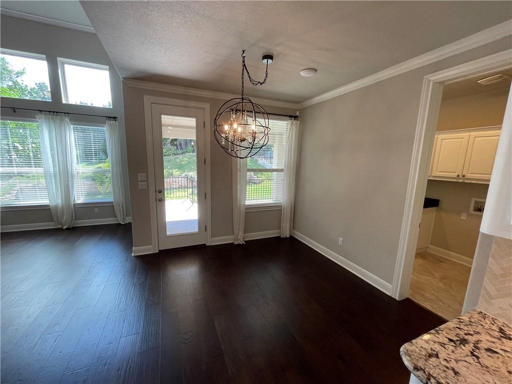 3501 Venezia View Leander, TX 78641 - Photo 6 of 20 a view of an empty room with wooden floor and a window