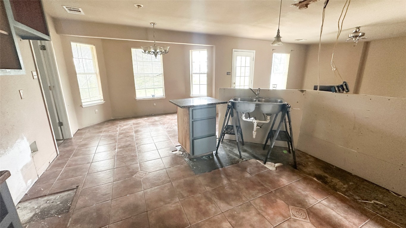 258 Pine View Loop Bastrop, TX 78602 - Photo 12 of 14 a view of a dining room with furniture window and wooden floor